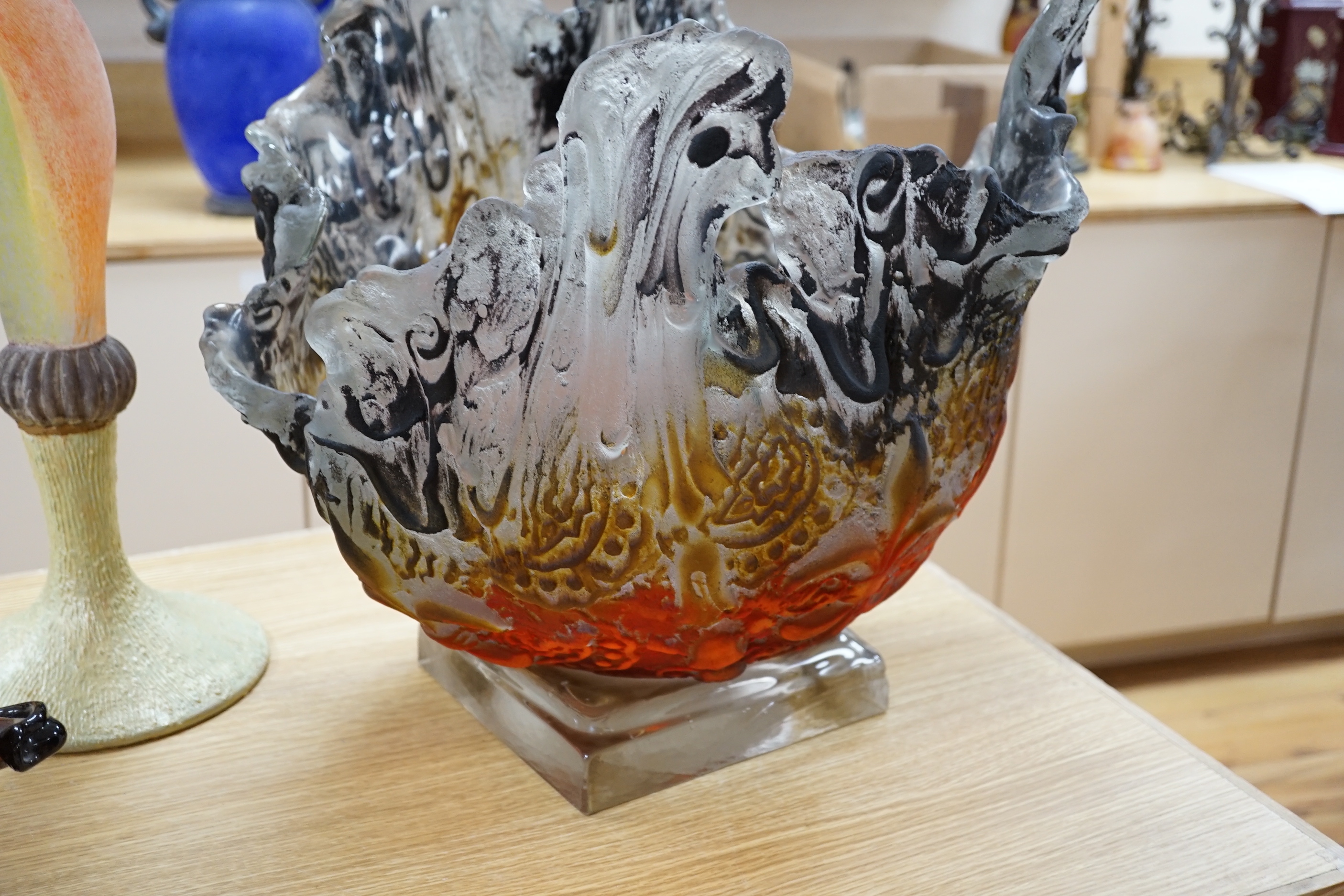 A large art glass textured centrepiece on stand, with amber orange and black matt over glazing 49 cm high